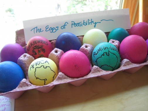 Colorfully dyed eggs with a sign reading "The Eggs of Possibility"