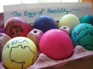 Colorful dyed eggs with a sign reading "The Eggs of Possibility" 